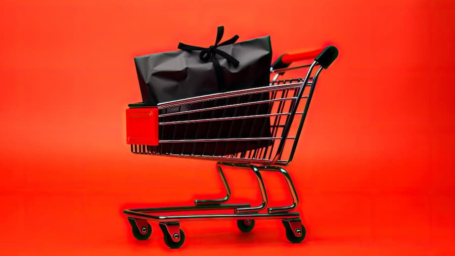 A shopping cart with a red background showcasing free ecommerce platforms to start an online store